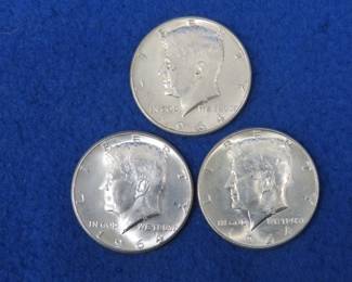 Lot 134. Three 1964 Kennedy half dollars