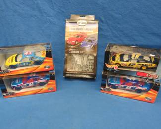 Lot 392. Four Hot Wheels racing cars in 1:24 scale and a Testors "Rad Rides of the Road" two car model kit