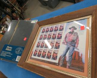 Lot 286. Framed 20-stamp sheet of John Wayne 37-cent stamps, and an unused commemorative stamp album, and more