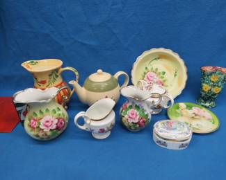 Lot 70. Three pitchers, Gail Pittman, Japan. music box, Italian pottery vase, and more.