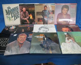 Lot 232. 12 LPs including, Marshall Tucker, Merle Haggard, Jim Reeves, Conway Twitty, STAR WARS, and more
