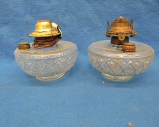 Lot 380. Two kerosene lamp bases. One has been electrified. The other