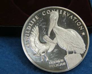 Lot 336. 1972 Postmasters of America Pelican coin. 25.19 grams of sterling
