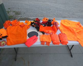 Lot 121. Deer hunter starting kit including wool pants, shooting gloves, socks, targets, and more
