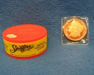 Lot 89. 50 Federal Spitfire .22 LR and a one ounce copper coin