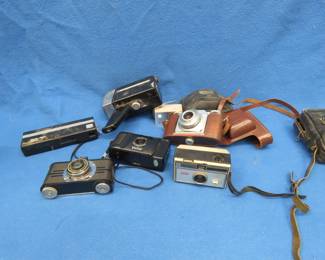 Lot 73. Seven cameras and flash units