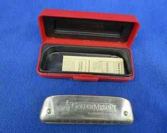 Lot 66. Hohner Golden Melody diatonic harmonica in the key of E in a plastic box with paper