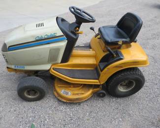 Lot 260. Series 2000 Cub Cadet lawn tractor and snowblower attachment. Has18 HP Kohler engine showing 257 hours, twin bagging system, manuals, and tire chains