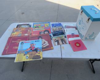 Lot 106. Vintage kids' LPs and 45s and a record case