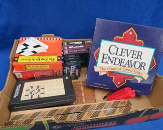 Lot 179. Board games, VHS, Cribbage board, and more