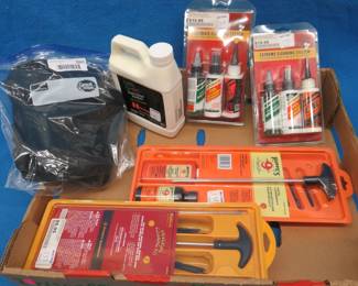 Lot 251. Two NIP multi-firearms cleaning kits, two NIP lubricants and cleaners, Hornady cleaning solution and a NIP 3x Glock T-shirt