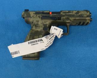 Lot 12. Canik Mete SFT 9mm semi-auto pistol. Includes two magazines, speed loader, cleaning accessories, manual, paddle holster, and more.
