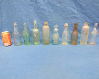 Lot 79. Nine old bottles recovered from a Minnesota lake bottom