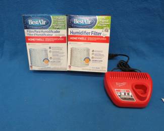 Lot 397. Two new humidifier filters and a Milwaukee M12 battery charger