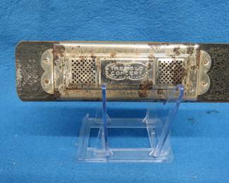 Lot 30. Unknown Mfg Hero T concert double-sided harmonica with bell reeds. Poor condition.