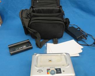 Lot 141. Kodak EasyShare printer dock Series 3 with case and a Minolta Dimage7 digital camera
