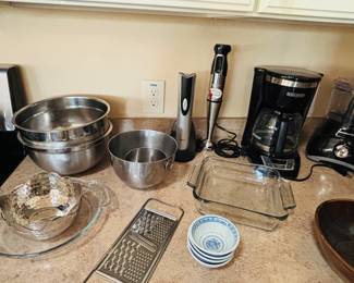 Cheese grater and baking dish.  Lasagna time.