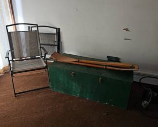 Folding chairs, boat oars, wooden chest