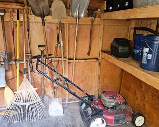 Lawn mower, rake, assorted shovels