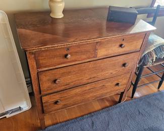 Wood dresser, wooden chest of draws, table lamp
