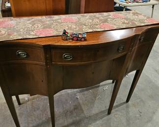 Mahogany Side Board with a Bow Front