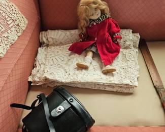 Lace tablecloth, doll with red dress, 