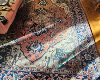 Very large Oriental fringed rug with pinks, blues