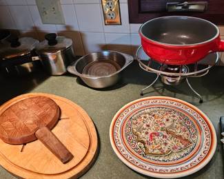 Large oval wooden cutting board, Cutting board with knife inside handle, tea pot, Sauce pans, sauce pots, Silver bowl with handles, Fondue set red enameled cast iron