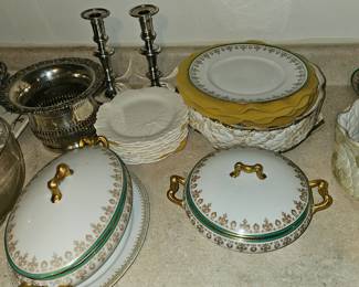 Covered vegetable bowls, matching china plates, candle sticks