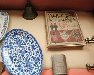 Blue and white porcelain phoenix bird floral platter, Flask, Alice In Wonderland book, Brass bell with wood handle