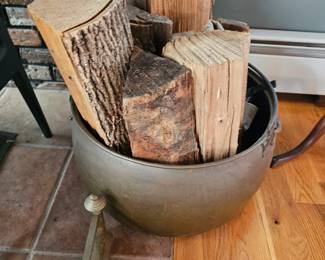 brass pot with fireplace wood