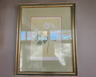 Framed art work of a flower