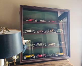 Die cast cars in case, table lamp