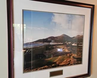framed art work, coastal landscape of a beach, hills and town