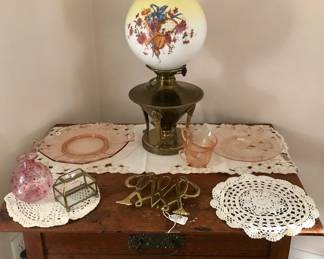 Sweet victorian table with drawer... B&H oil lamp converted to electricity... Thomas Jefferson Monticello brass trivet.. pink glassware & grandmas doilies