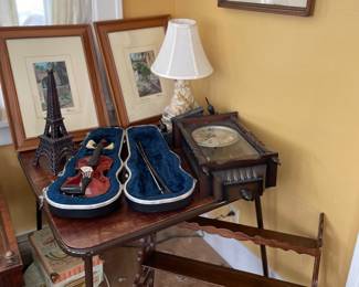 Violin, clock, table, wall art, shelf