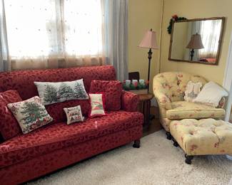 Great couch, pillows, mirror, and chair with ottoman