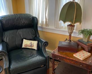 Green recliner and side table,