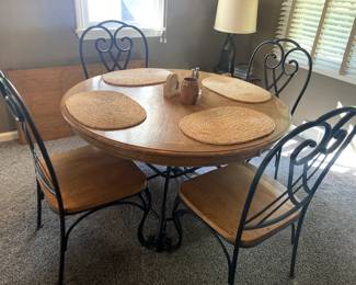 Wrought iron and oak dining room table w/ 4 chairs and 24" leaf