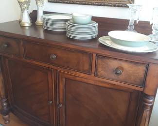 Another beautiful antique... this pretty sideboard is great not only in a dining area, but would be awesome for a foyer or breakfast room area as well