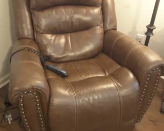 Electric lift chair in good working condition. The seat has a small separation in the same but can be easily covered with a cushion or pad.