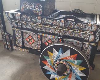 This is one of the cutest pieces I think I've ever had in my 30 plus years of doing estate sales. The hand painting details on this wooden car is unbelievable. I have been told that it originated from Germany and that it is a food cart. I can see it being used as a flower cart, on a Sun porch, or a photographer's prop!