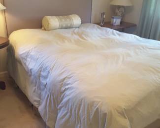 Queen size bed and mattress set with upholstered headboard.