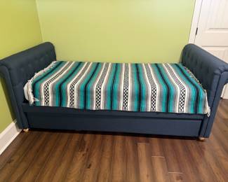 upholstered daybed with pullout bottom makes two twin beds 150.00