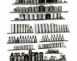 Large Group Of Socket Wrenches And Bits On Organizing Rails