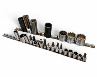 Group Of Steel Sockets On Organizing Socket Rails