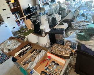 Long table full of kitchenware