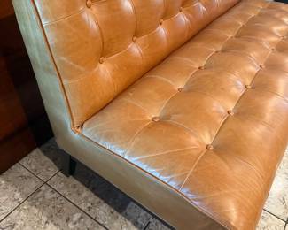 Two seater tufted leather bench/couch. Lovely caramel color, dark brown wood legs. Height sitting area 18.5", w/back support 33",D 27"