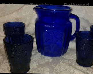 Depression glass pitcher with 4 glasses. Colbalt Blue
