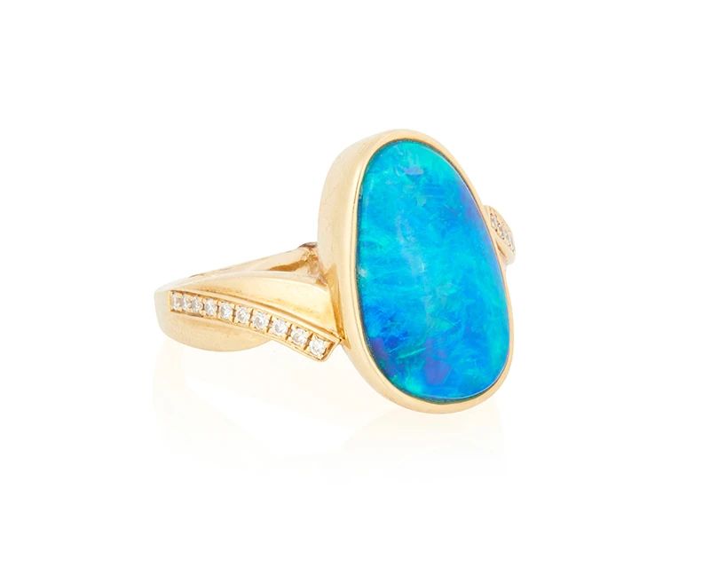 1001
An 18K Gold and Opal Ring
Featuring an organic-shaped opal cabochon measuring approximately 15.14 x 9.16 mm, accented by round diamonds

Size: 5 1/4
6.76 grams gross
Estimate: $500 - $700